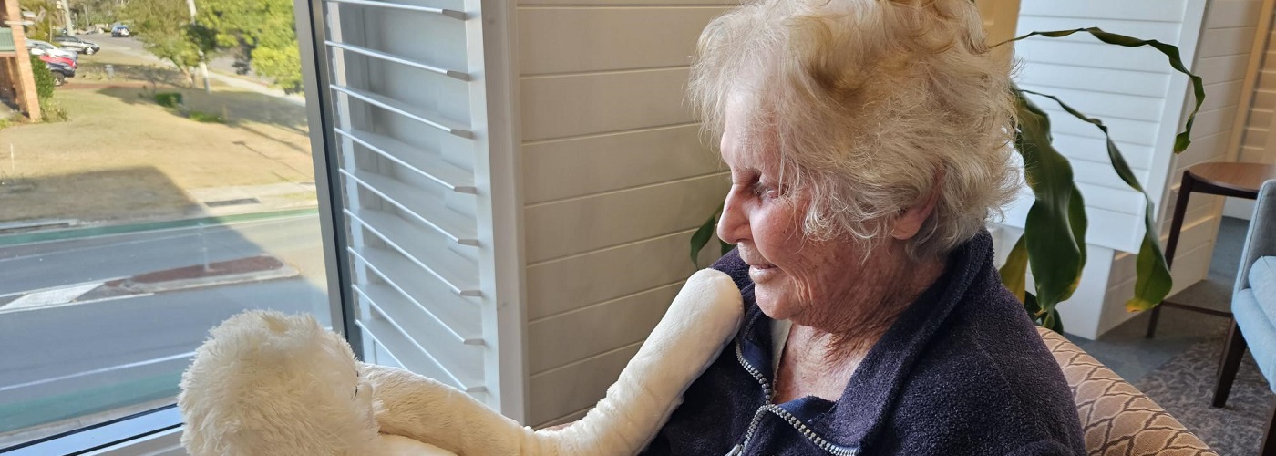 Seaton Place resident with cuddly companion HUG