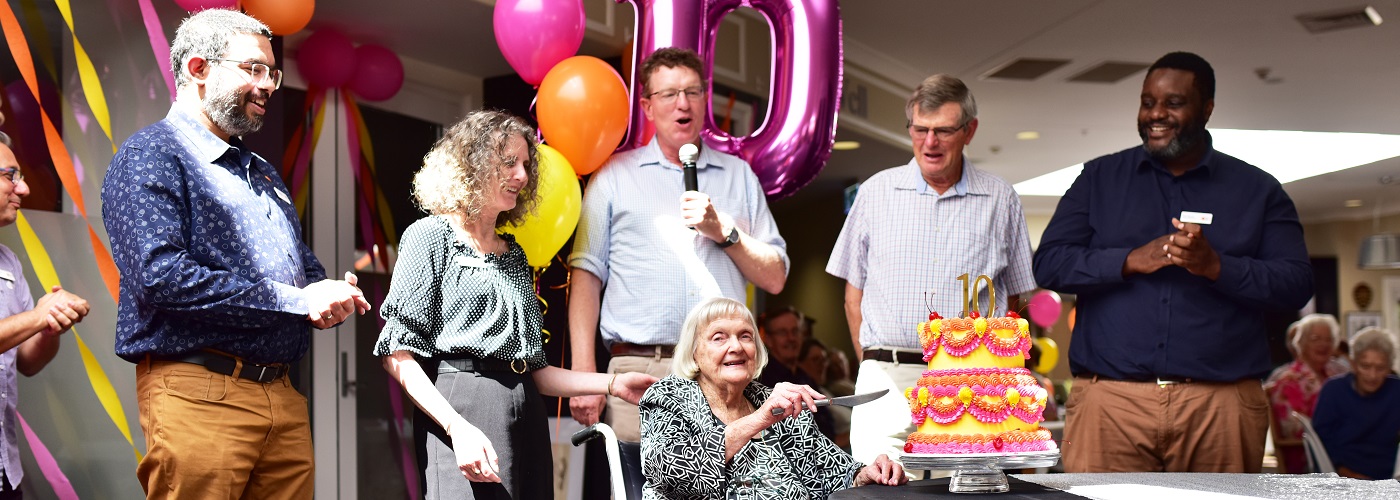 Betty cutting the cake for Gosling Creek 10 year anniversary.jpg