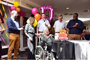 Betty cutting the cake for Gosling Creek 10 year anniversary_.jpg