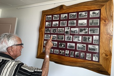 Frank looking through his photos from the early days of Caboolture_.jpg