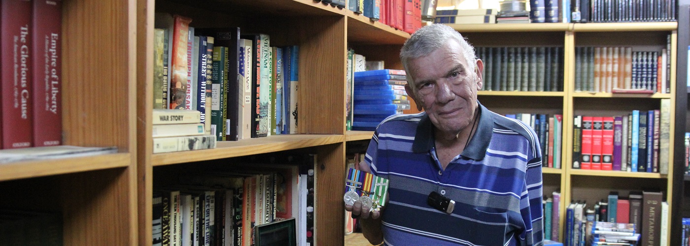 Gus in his home library.jpg