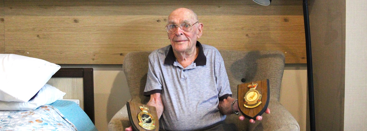 Lewis with his awarded service plaques.jpg