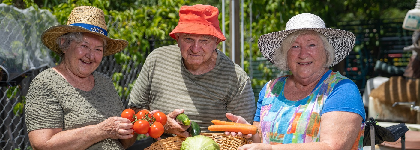Rowes Bay residents in the community garden
