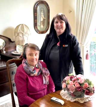 Clinical Nurse uses amplification devices to support client communication during nursing assessments.